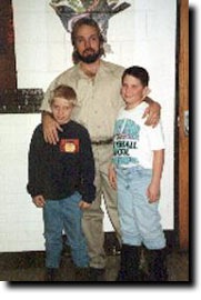 Kyle Lindquist with his sons during prison visitation